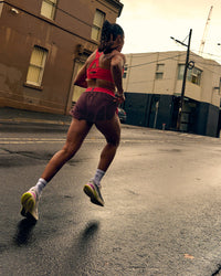 Woman wearing Accelerate 3" Mid-Rise Running Short - Cherry Lacquer-Scarlet | Thumbnail Index: 8