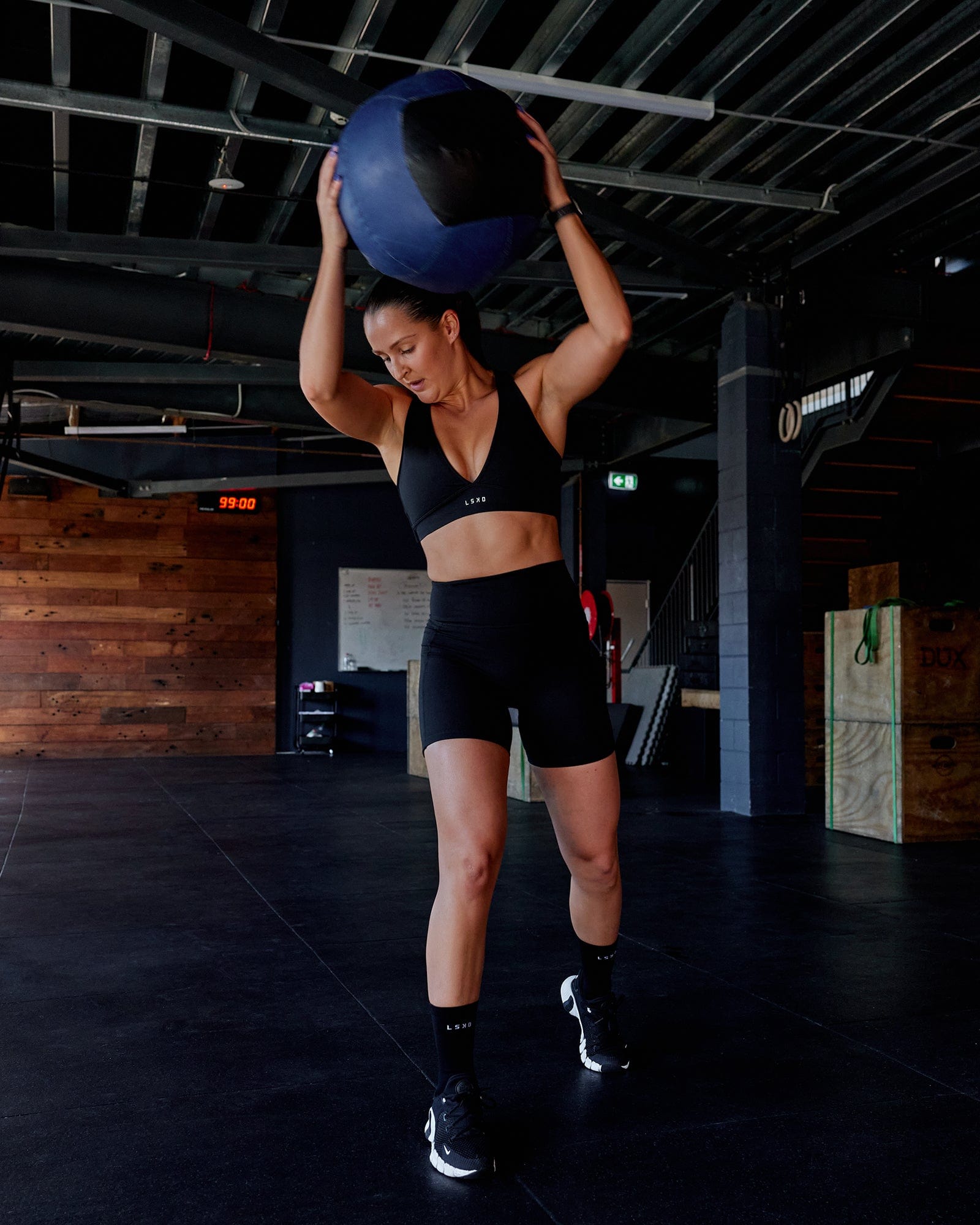Woman wearing O.G. Fusion Ultra High-Rise 6" Short Pockets - Black | Model:Abbey | Size:S