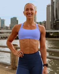 Woman wearing Velocity Sports Bra - Bluebell | Model:Bec| Size:S | Thumbnail Index: 0