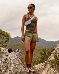 Woman wearing Accelerate 3" Mid-Rise Running Short - Pure Olive-Fog | Thumbnail Index: 1
