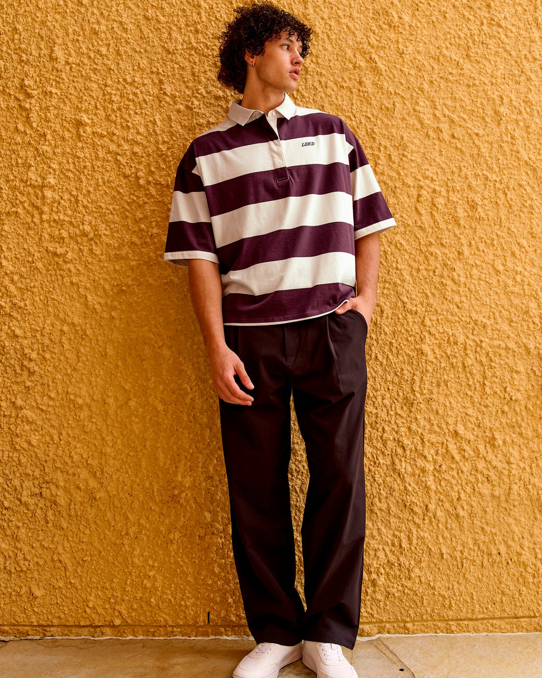 
Man wearing Oversized Rugby Polo - Off White-Cherry | Model:Malebo | Size:M