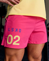 Man wearing Pace 5" Lined Running Short - Game Plan Ultra Pink | Thumbnail Index: 0
