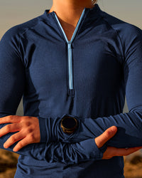 Woman wearing GG AeroFLX+ Long Sleeve Half Zip - Future Navy-Baltic Sea | Model:Grace | Size:XS | Thumbnail Index: 0