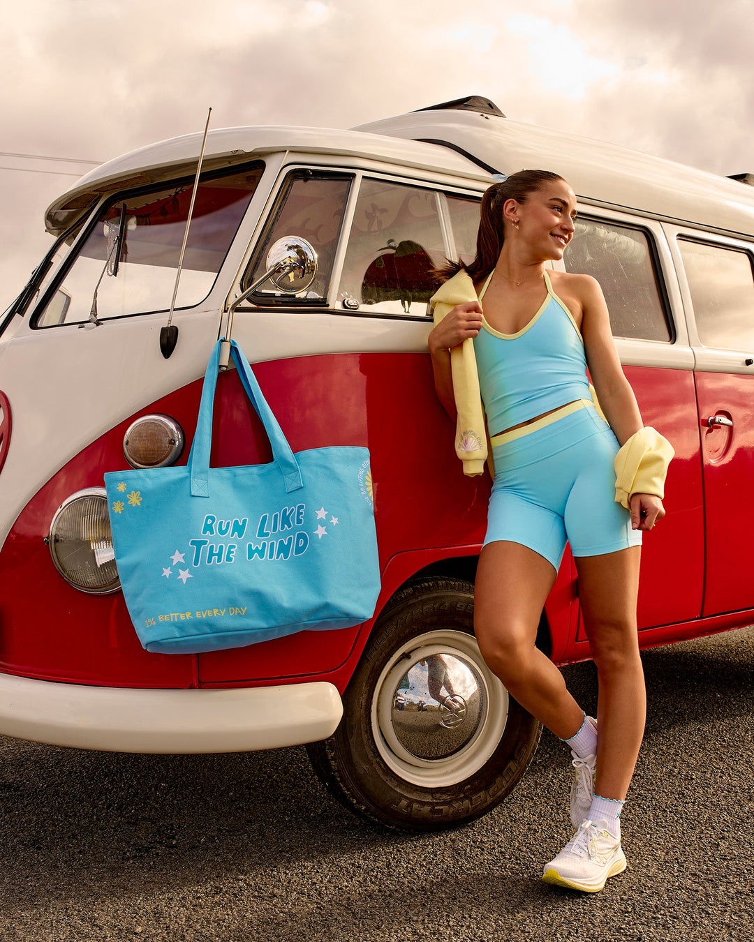 Woman wearing Lume Fusion Mid-Rise V Contour 6" Short Pockets - Baltic Sea-Lemon | Model:Grace | Size:XS