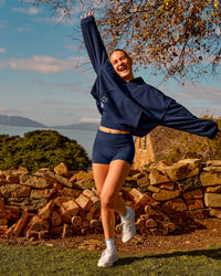 Woman wearing Groovy High Rise Fold Over 4" Short - Future Navy | Model:Brianna | Size:XS