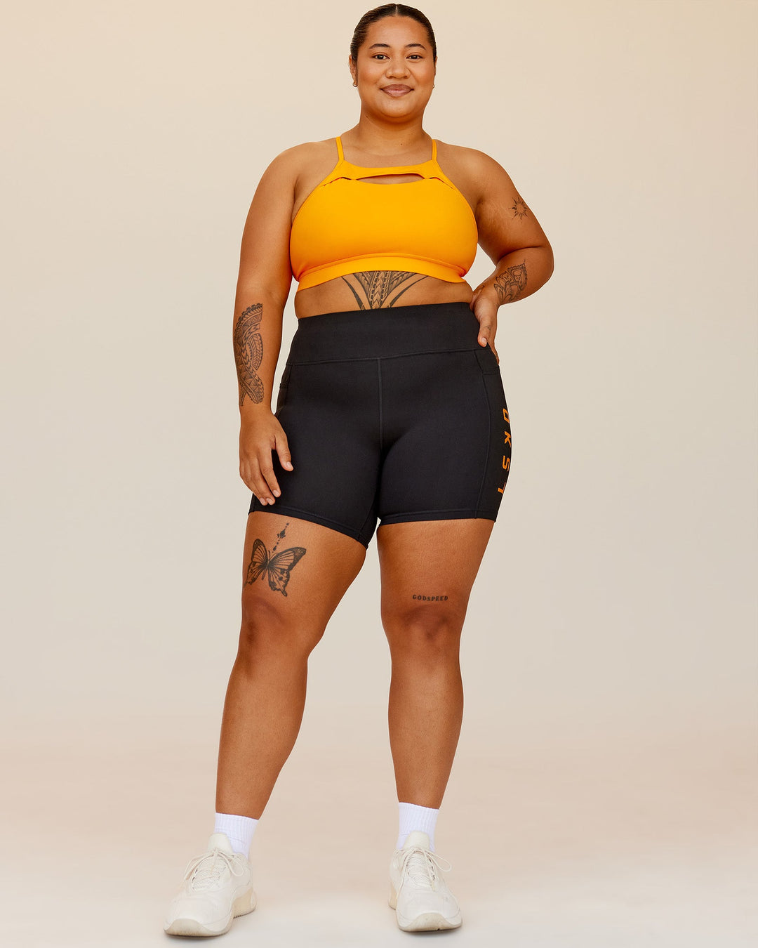 Woman wearing Be Bold Sports Bra - Zinnia | Model:Sarah | Size:2XL