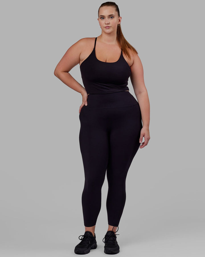 Woman wearing Elixir Full Length Tight - Black No Logo
