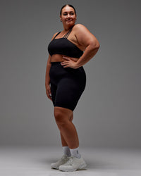 Woman wearing Fusion Ultra High-Rise 9" Short Pockets - Black | Model:Jordie | Size:2XL