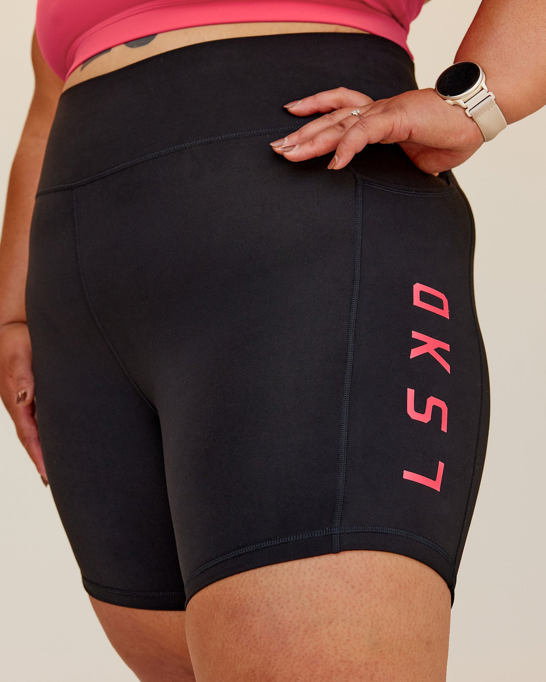 Woman wearing Rep Ultra High-Rise 6&quot; Short Pockets - Black-Bright Raspberry | Model:Lilz | Size:3XL