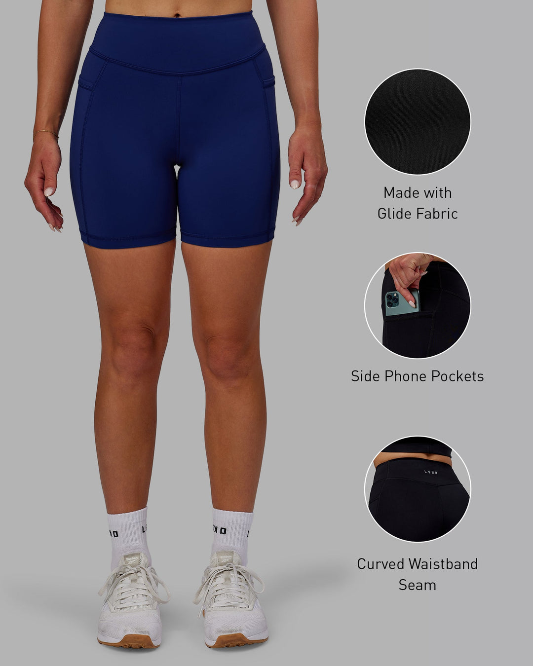 Woman wearing Elite Mid-Length Shorts - Midnight Blue