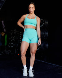 Woman wearing Advance Sports Bra - Aquatic Awe