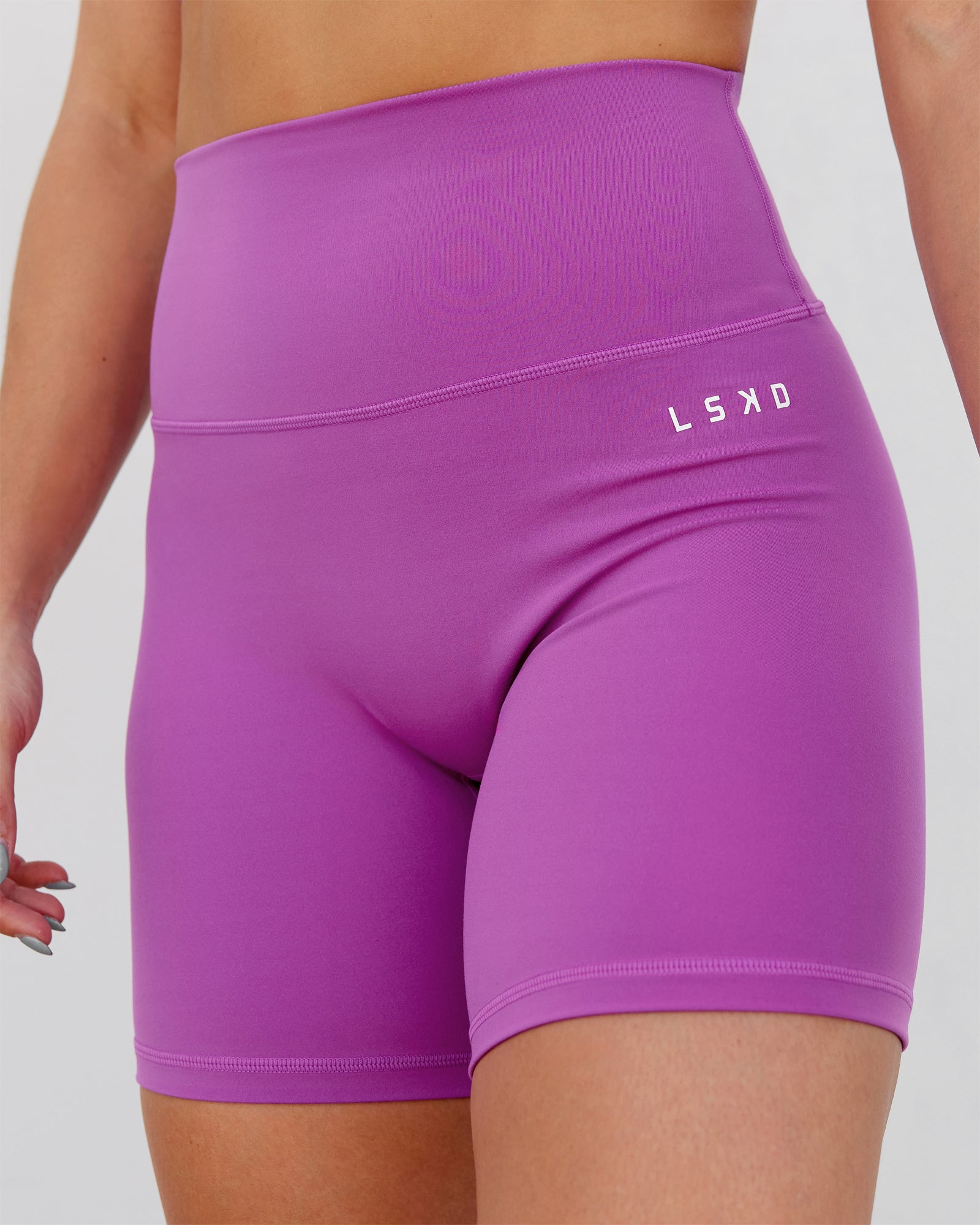 Woman wearing Base 2.0 Ultra High-Rise 6" Short - Hyper Violet