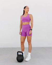 Woman wearing Base 2.0 Ultra High-Rise 6" Short - Hyper Violet
