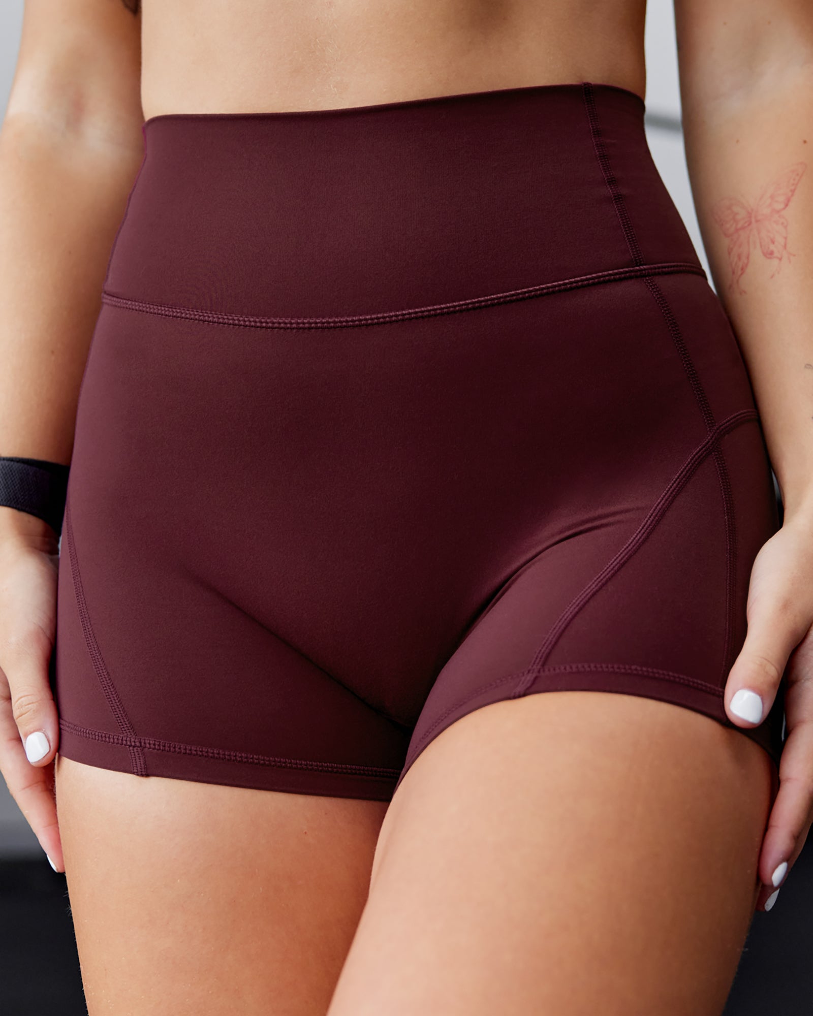 Woman wearing Bend Ultra High-Rise 4" Short - Dark Cherry