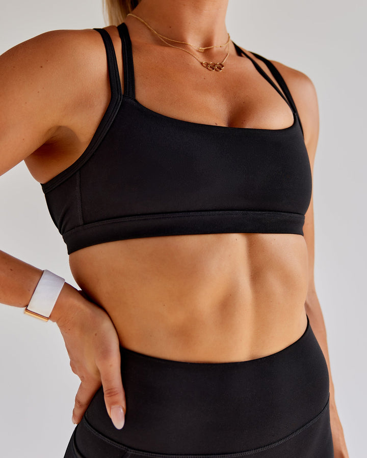 Woman wearing Bree Masters Velocity Sports Bra - Black
