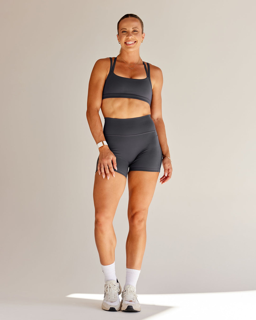 Woman wearing Bree Masters Velocity Sports Bra - Stormy