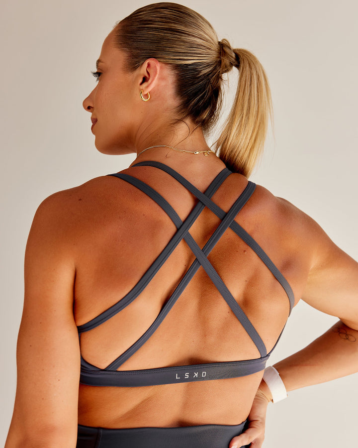 Woman wearing Bree Masters Velocity Sports Bra - Stormy
