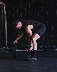 Man wearing Challenger 6" Lined Performance Short - Black