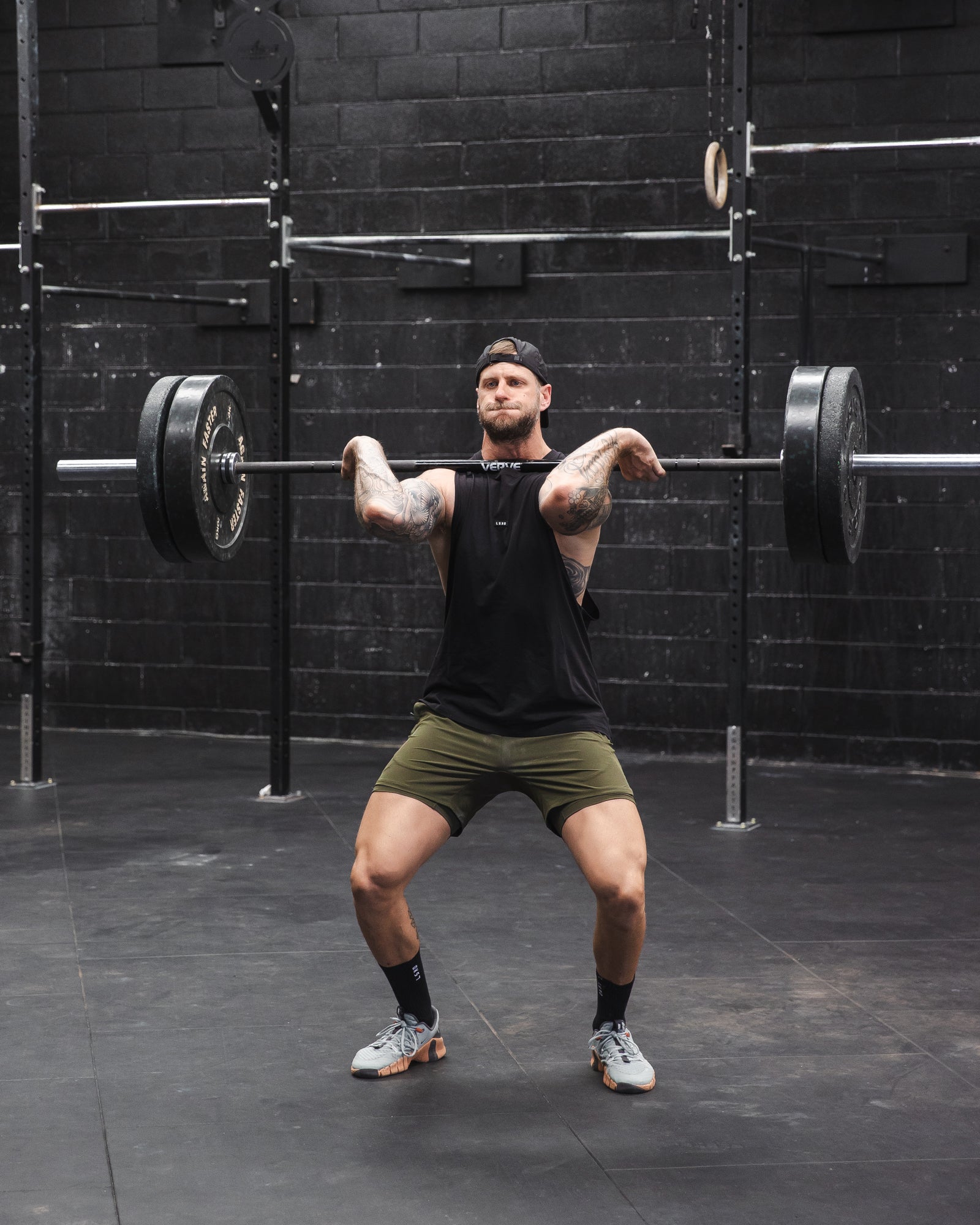 Man wearing Challenger 6" Lined Performance Short - Forest Night