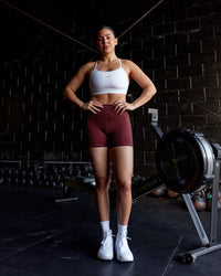 Woman wearing Elite High-Rise 4" Short Pockets - Dark Cherry