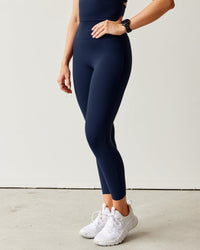 Woman wearing Elixir Ultra High-Rise 7/8 Legging - Future Navy