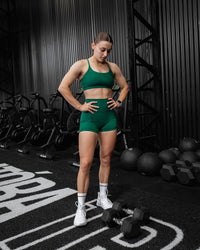 Woman wearing Elixir Ultra High-Rise 4" Short Pockets - Malachite