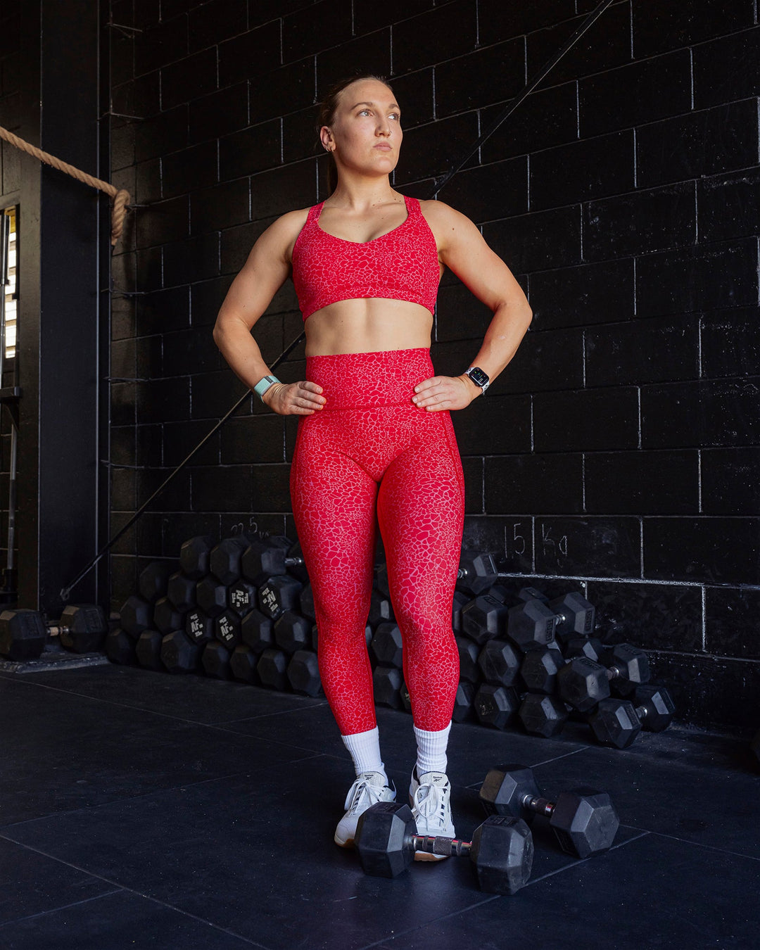 Woman wearing Fusion Ultra High-Rise 7/8 Legging Pockets - Red Vitality Print | Model:Merita | Size:S