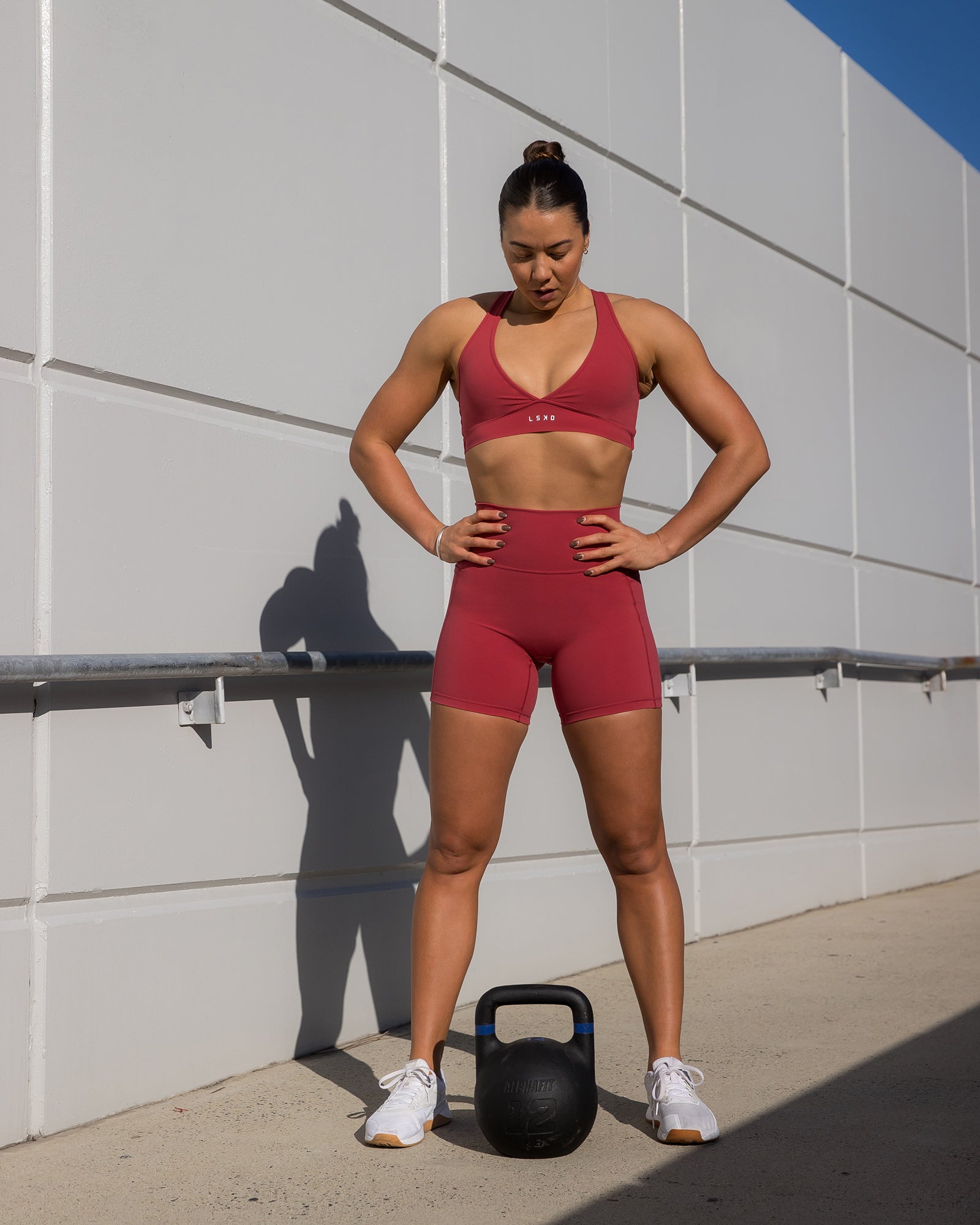 Woman wearing Fusion Ultra High-Rise 6" Short Pockets - Claret | Model:Bailey | Size:S