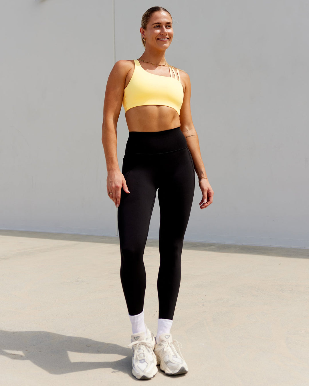 Woman wearing Galvanise Sports Bra - Lemon