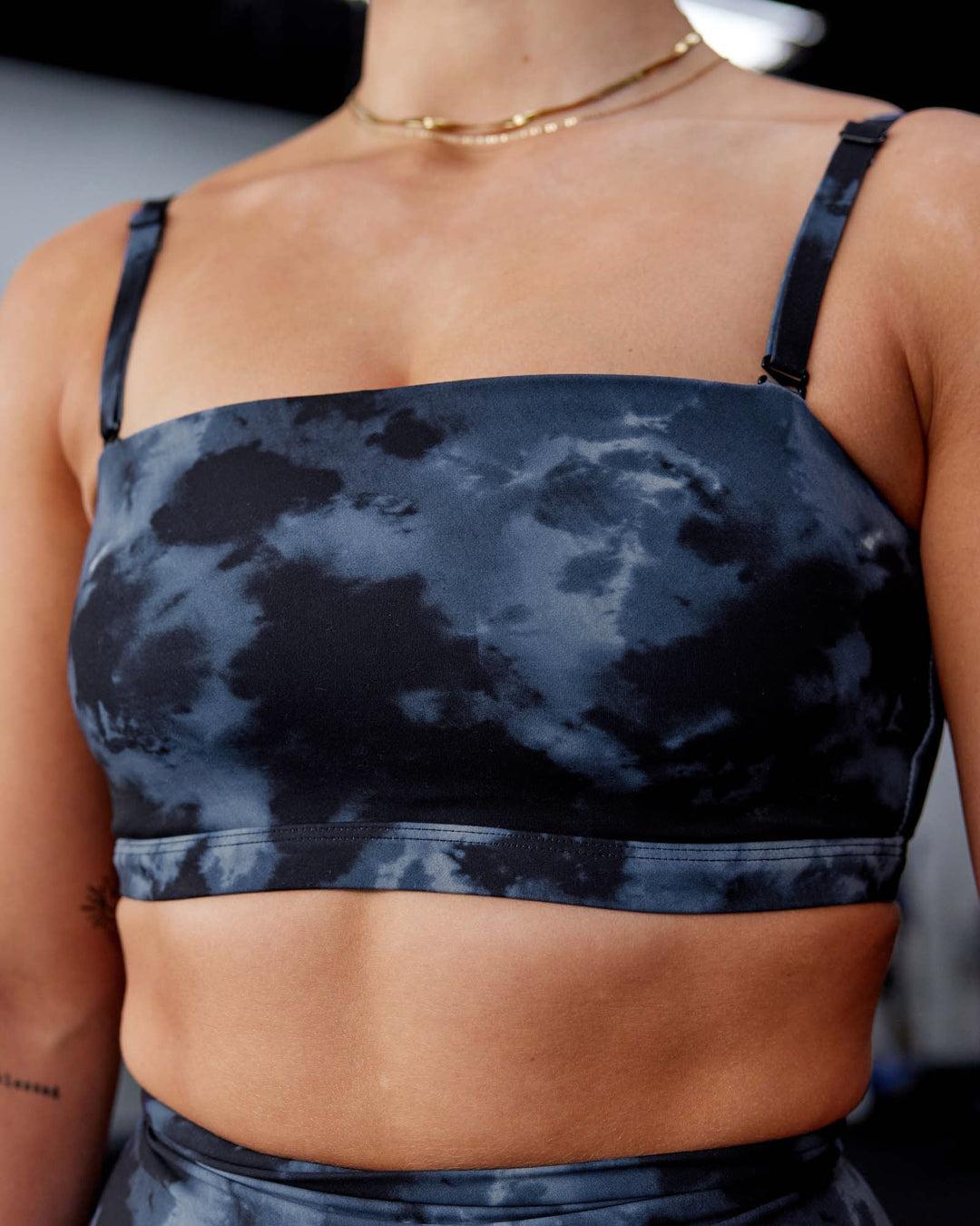 Woman wearing Inspire Sports Bra - Tie Dye-Midnight