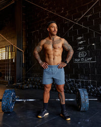 Man wearing Lift 6" Performance Shorts - Elemental Blue