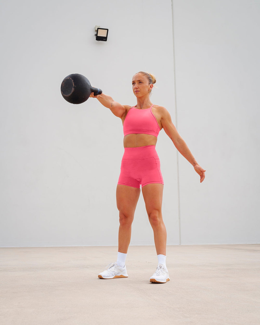 Woman wearing Lift High Neck Sports Bra - Hot Pink