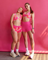 Woman wearing Stamina Rise Sports Bra - Pink Glow Print | Size:S