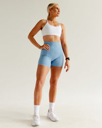 Woman wearing Twist Sports Bra - White | Thumbnail Index: 6