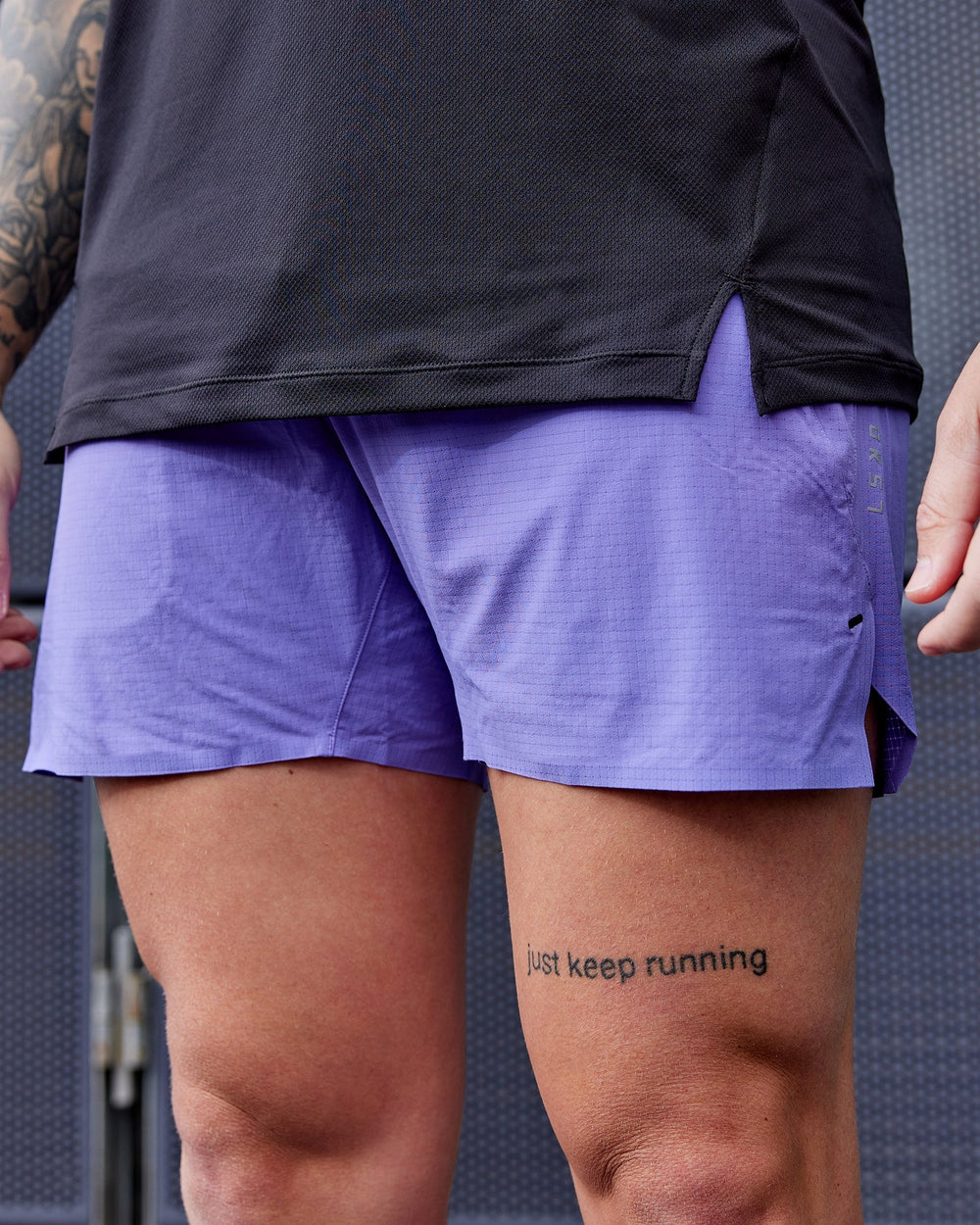 Man wearing UltraAir 5" Lined Performance Shorts - Dahlia Purple