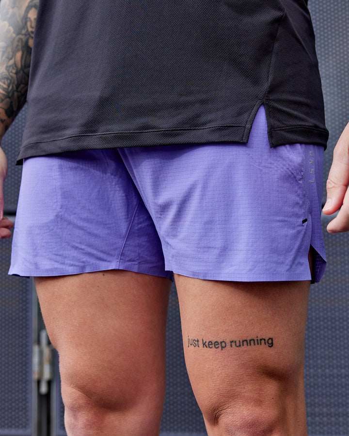 Man wearing UltraAir 5&quot; Lined Performance Shorts - Dahlia Purple
