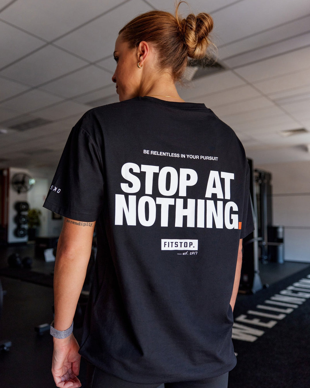 Woman wearing Unisex Fitstop Stop at Nothing Tee Oversize - Black-White