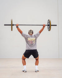 Man wearing Unisex Miami25 Washed FLXCotton Tee Oversize - Storm Front-Lemon Fizz