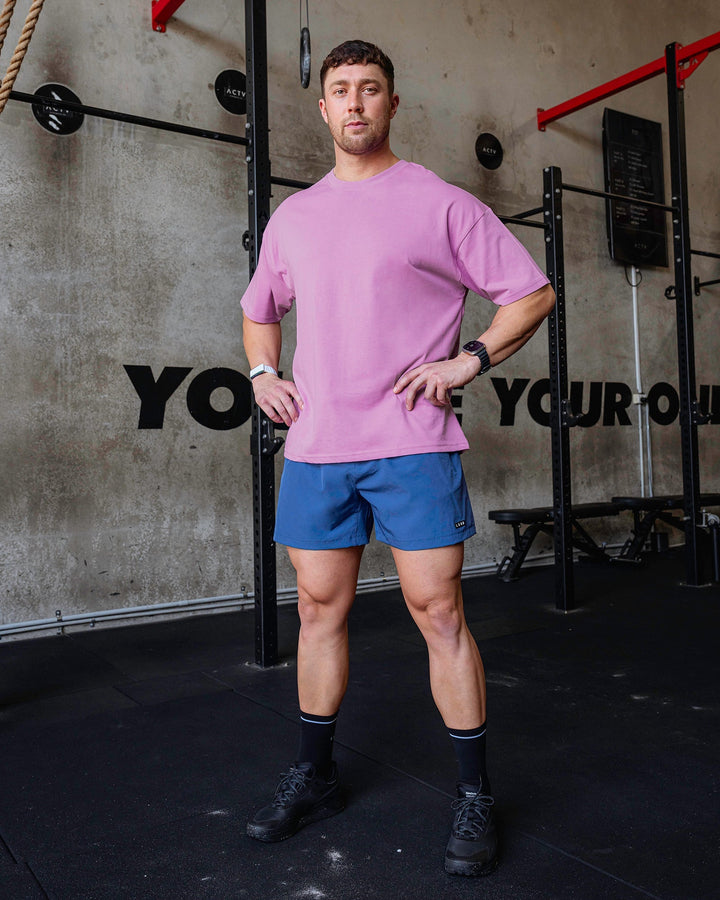 Man wearing Unisex Pressure Heavyweight Tee Oversize - Light Violet-White
