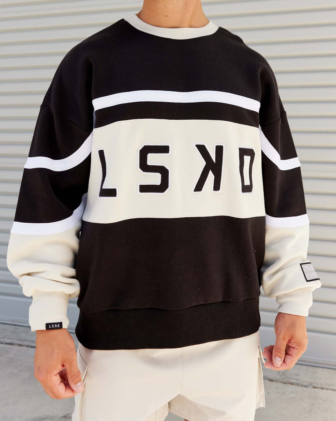 Man wearing Unisex PrimeTime Sweater Oversize - Black-Bone