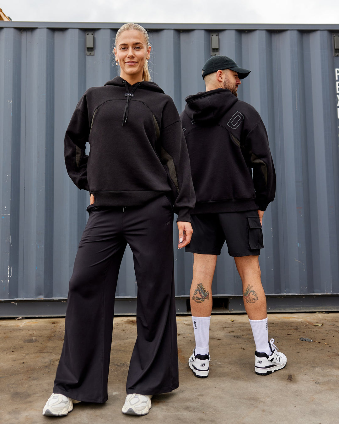 Duo wearing Unisex Y2K Concept Panel Hoodie - Black-Black-Pirate Black