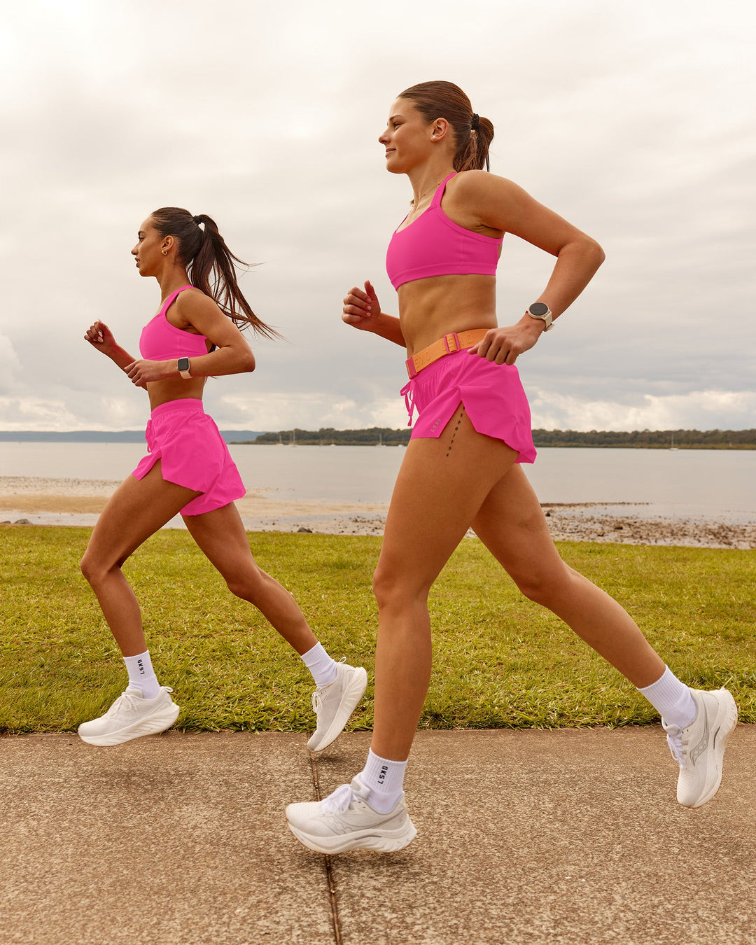 Woman wearing Velocity Sports Bra - Ultra Pink | Model:Duo | Size:Both