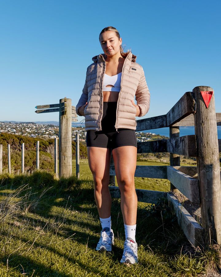 Woman wearing All Day Puffer Jacket - Desert
