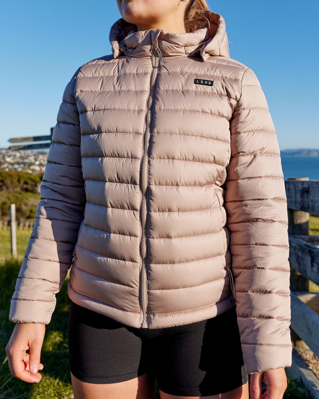 Woman wearing All Day Puffer Jacket - Desert