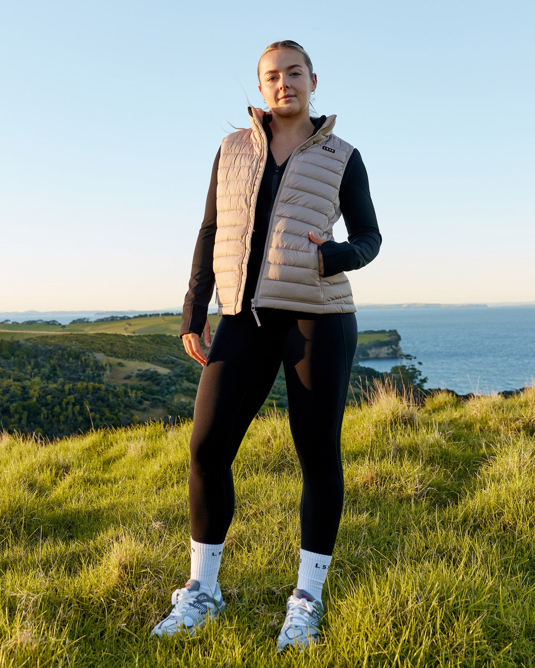 Woman wearing All Day Puffer Vest - Desert