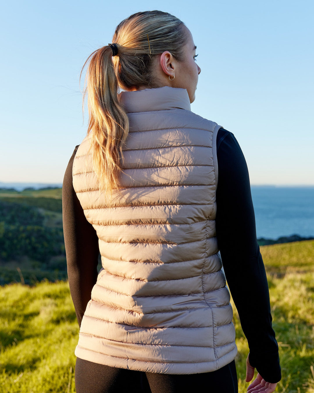 Woman wearing All Day Puffer Vest - Desert