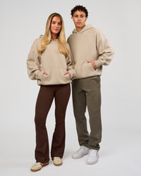 Duo wearing Base Oversized Hoodie - Shale Beige | Model:Leandro | Size:M | Model:Issy | Size: XS | | Thumbnail Index: 9
