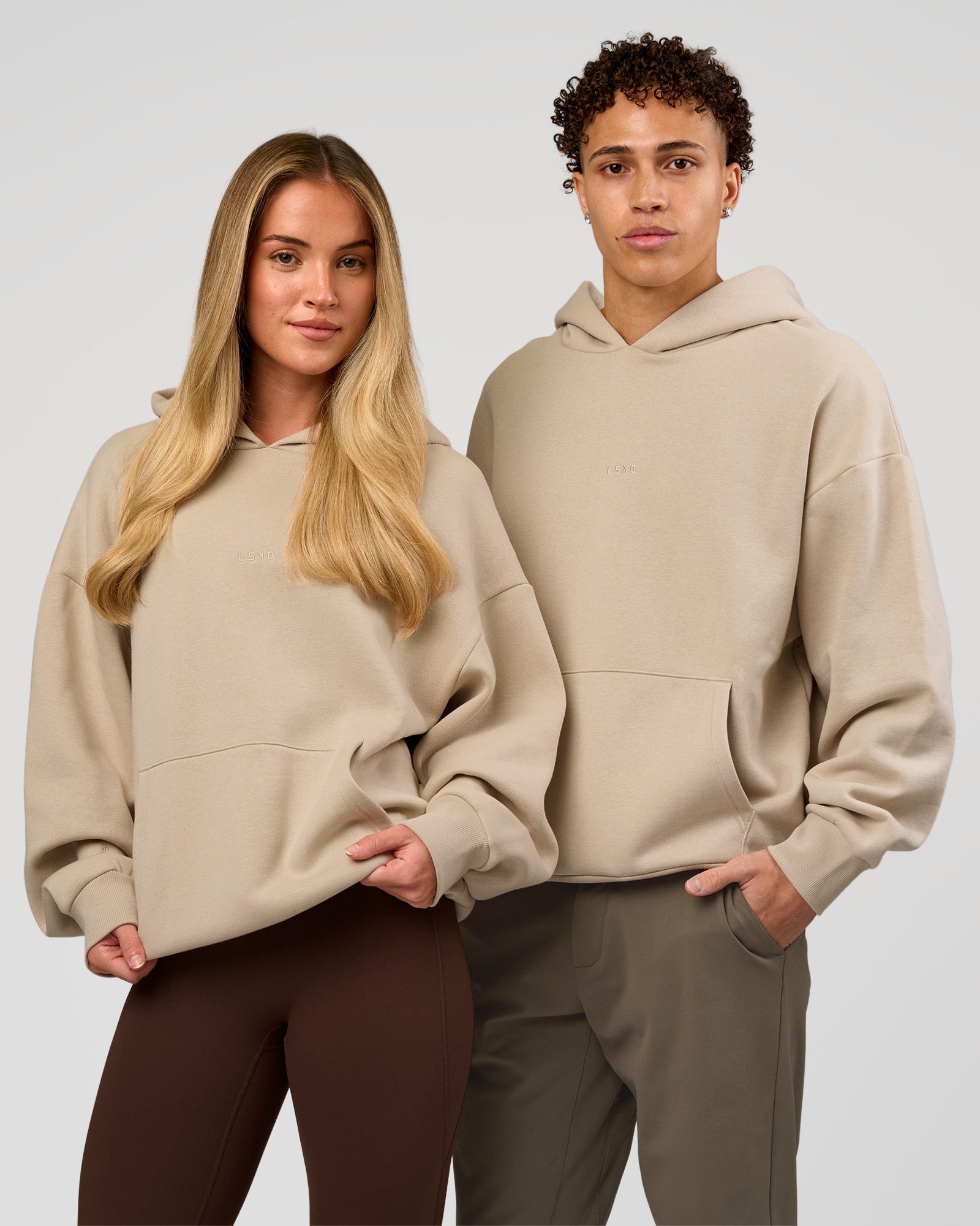 Duo wearing Base Oversized Hoodie - Shale Beige | Model:Leandro | Size:M | Model:Issy | Size: XS |