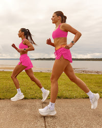 Woman wearing Accelerate 3" High-Rise Running Short - Ultra Pink | Model:Duo | Size:Both