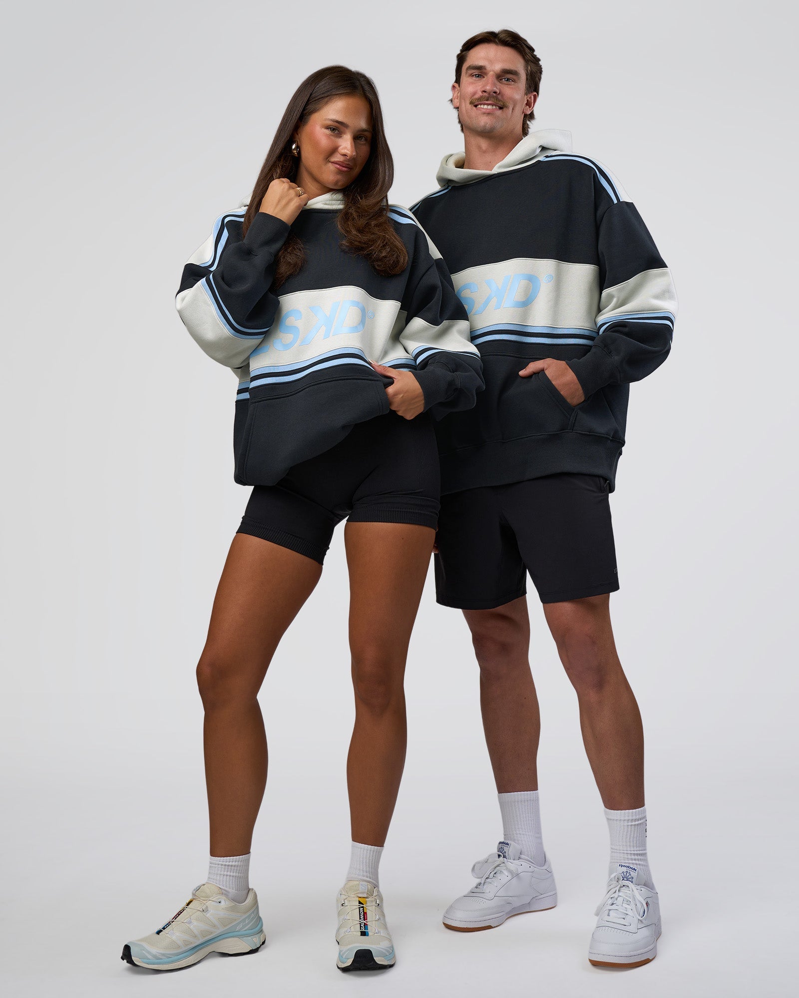 Duo wearing A-Team Oversized Hoodie - Caviar-Open Air | Model:Both | Size:Duo